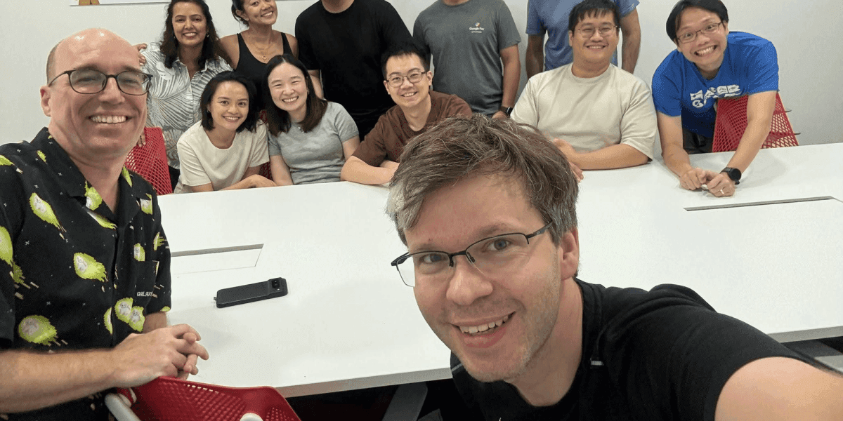 Brian, Tom, and a group they were hosting at Teamwork Unlocked